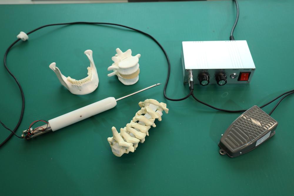 Collaboratively Controlled Dexterous Surgical Robotic System for Confined-Space Bone Work