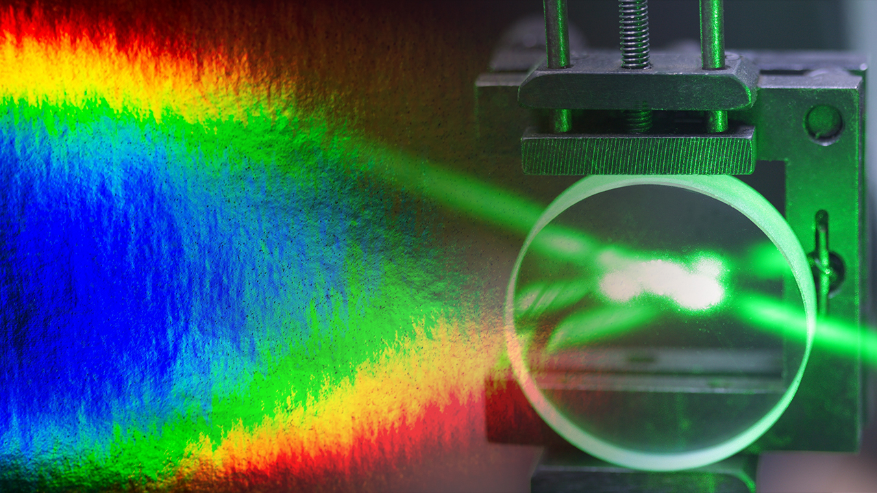 Tunable laser materials comprising solid-state blended polymers
